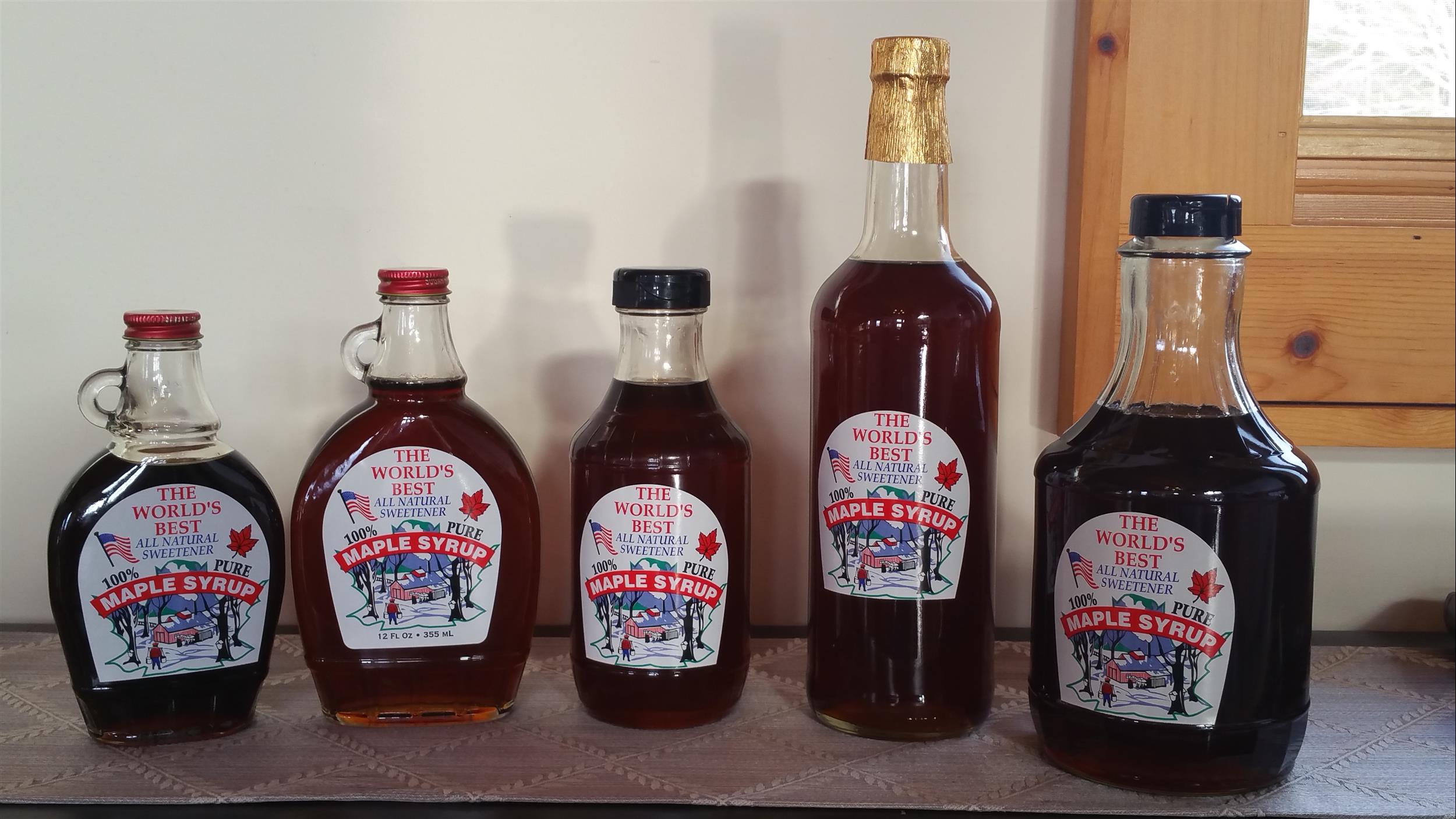 5 glass bottles of Tenwood Lodge Maple syrup 
